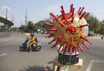 Police placed a virus themed globe at a traffic signal aimed at creating awareness about the coronavirus.