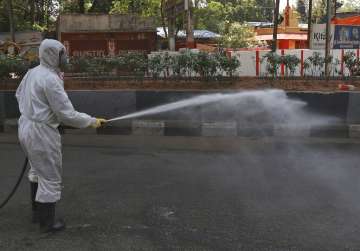 A National Disaster Response Force soldier disinfects an area during lockdown to prevent the spread 
