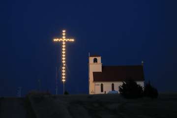 Known as The Lighted Cross Church, Excelsior Lutheran Church near Wilson, Kan., is dark, Friday, Apr