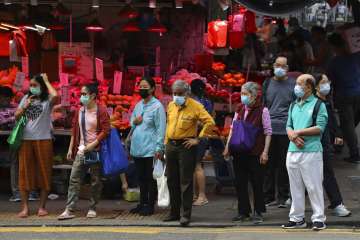 People wearing face masks to help protect themselves from contracting the coronavirus COVID-19 as th