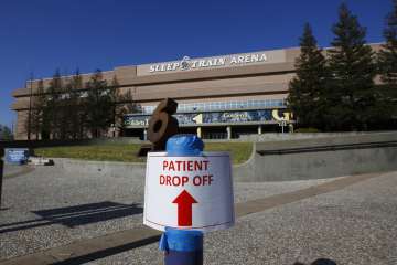 A temporary sign is placed at the the Sleep Train Arena that is being turned into a 400-bed emergenc