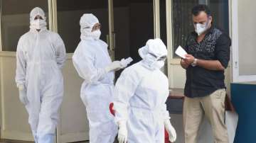 File image of medical staff wearing masks and protective suits outside an isolation ward in Kochi, Kerala 