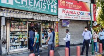 A file photo of buyers queuing up outside a drug store in New Delhi