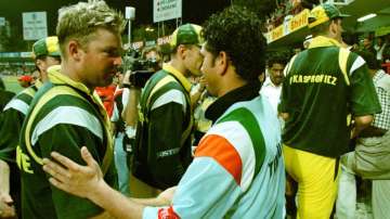Indian cricketer Sachin Tendulkar (C) shakes hands with Australian cricketers after the Indian victory against Australia in a final match in Sharjah 24 April.