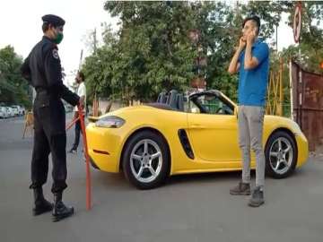 Indore: Porsche driver penalised for breaking COVID-19 lockdown; made to do sit-ups | Video