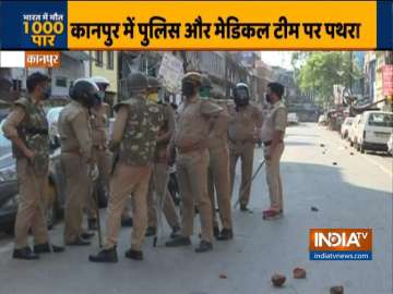 Police personnel at Kanpur's Chamanganj area after being pelted with stones