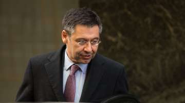 FC Barcelona President Josep Maria Bartomeu stands with players in salary pay cut issue