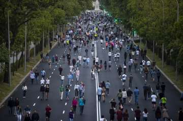  People exercise along Paseo de la Castellana after the lockdown measures imposed by the government 