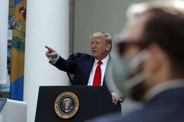 President Donald Trump speaks about the coronavirus during a press briefing in the Rose Garden of th