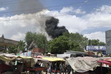 Smokes rises from a hospital after gunmen attacked in Kabul, Afghanistan, Tuesday, May 12, 2020. Gun