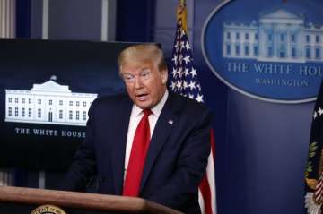 President Donald Trump speaks with reporters about the coronavirus in the James Brady Briefing Room 