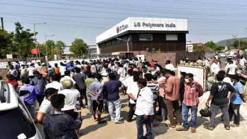 A crowd gathers outside the LG Polymers plant from where chemical gas leaked in Vishakhapatnam