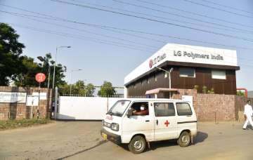 An ambulance drives past the LG Polymers plant from where chemical gas leaked in Vishakhapatnam