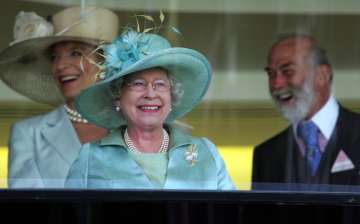 FILE - In this Wednesday, June 21, 2006 file photo, Britain' Queen Elizabeth II, centre, with Prince Michael of Kent, and Princess Michael of Kent celebrate after the horse Ouija Board won the Prince of Wales Stakes on the second day of the annual Royal Ascot horse race meeting, in Ascot, England. Queen Elizabeth II will not be attending the Royal Ascot horse racing meeting for the first time during her 68-year reign. The meeting, which commences Tuesday, June 16, 2020 is one of the country’s most high-profile horse racing meetings and one that effectively launches a great British summer of sport that also includes Wimbledon tennis and golf’s Open Championship. (AP Photo/Alastair Grant)
 