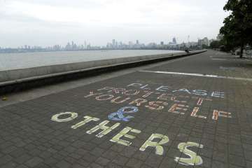 A message written on the Arabian Sea coast in Mumbai, India, Tuesday, June 2, 2020. Cyclone Nisarga 
