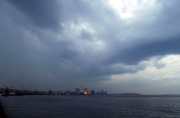 Rain clouds fill the sky on the Arabian Sea coast in Mumbai, India, Tuesday, June 2, 2020. Cyclone N
