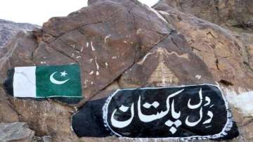 The Buddhist rock paintings dating back to 800 AD have been defaced with slogans and images of Pakistan flags