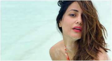  Bigg  Boss 11's Hina Khan poses in orange swimwear in these throwback pictures
