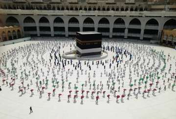 Hundreds of Muslim pilgrims circle the Kaaba, the cubic building at the Grand Mosque, as they keep social destination to protect themselves against the coronavirus ahead of the Hajj pilgrimage in the Muslim holy city of Mecca, Saudi Arabia, Wednesday, July 29, 2020. During the first rites of hajj, Muslims circle the Kaaba counter-clockwise seven times while reciting supplications to God, then walk between two hills where Ibrahim's wife, Hagar, is believed to have run as she searched for water for her dying son before God brought forth a well that runs to this day. (AP Photo)