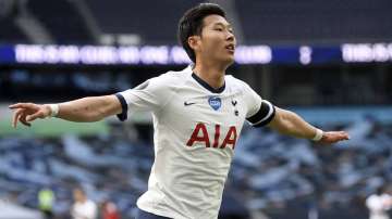 Tottenham's Son Heung-min celebrates after scoring his side's first goal during the English Premier League soccer match between Tottenham Hotspur and Arsenal at the Tottenham Hotspur Stadium in London, England, Sunday, July 12