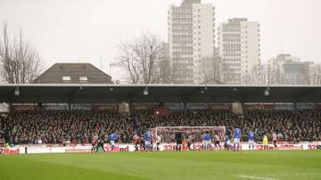 In this Saturday, Jan. 25, 2020 file photo, spectators watch from the stands of Griffin Park stadium