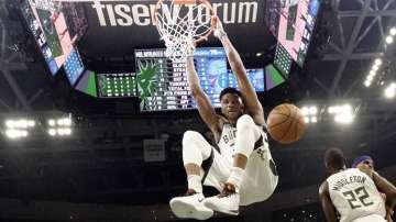 In this Feb. 22, 2020, file photo, Milwaukee Bucks' Giannis Antetokounmpo dunks during the first half of an NBA basketball game against the Philadelphia 76ers in Milwaukee