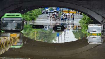 A DTC bus almost submerged at waterlogged Minto Bridge underpass after rains in New Delhi.