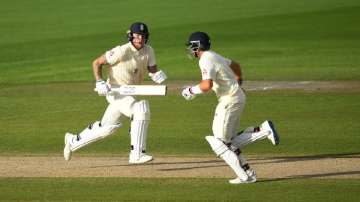Ben Stokes and Joe Root of England run during Day Four of the 2nd Test Match in the #RaiseTheBat Series between England and The West Indies at Emirates Old Trafford on July 19, 2020 in Manchester, England.?