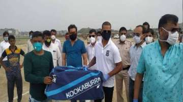 Indian cricketer Shikhar Dhawan gifting a cricket kit