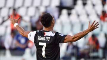 Juventus' Cristiano Ronaldo celebrates scoring his side's third goal, during the Serie A soccer match between Juventus and Torino, at the Allianz Stadium in Turin