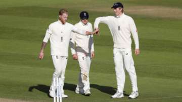 Ben Stokes of England celebrates with Dom Bess and Zak Crawley after taking the wicket of Alzarri Joseph of the West Indies (not pictured) during Day Three of the 1st #RaiseTheBat Test Series between England and The West Indies at The Ageas Bowl on July 10, 2020