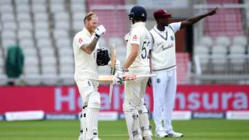 Ben Stokes of England embraces Dom Sibley after reaching his century during Day Two of the 2nd Test Match in the #RaiseTheBat Series between England and The West Indies at Emirates Old Trafford on July 17, 2020 in Manchester, England. 