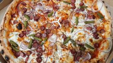 Eat without guilt! Study claims occasionally consuming whole pizza won't damage your health
