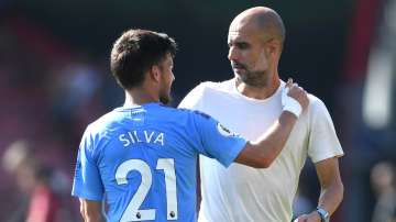 Manchester City manager Pep Guardiola with David Silva