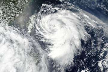 This Monday, Aug. 3, 2020, satellite image released by NASA shows Typhoon Hagupit over Taiwan, cente