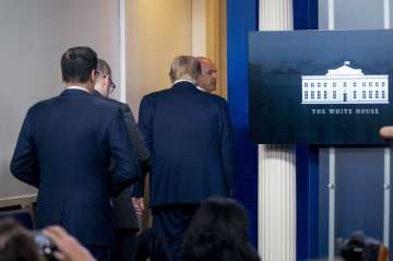 President Donald Trump is asked to leave the James Brady Press Briefing Room by a member of the U.S.