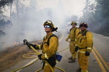 Firefighters Cody Nordstrom, Kyle Harp and Robert Gonzalez, from left, of the North Central Fire sta