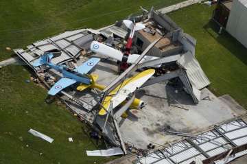  An airplane hanger is destroyed Thursday, Aug. 27, 2020, after Hurricane Laura went through the are