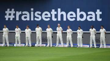 The England team stand for a minutes silence for those effected by Covid-19 in England and Pakistan prior to Day One of the 1st #RaiseTheBat Test Match between England and Pakistan at Emirates Old Trafford on August 05