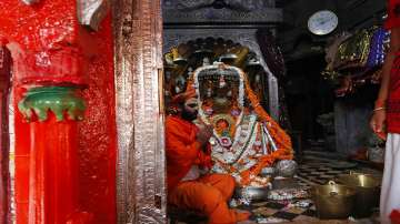 A priest perform religious rituals at Hanuman Garhi temple ahead of a groundbreaking ceremony Ram Mandir in Ayodhya.