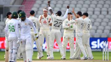 England celebrate the wicket of Shadab Khan of Pakistan on review during Day Three of the 1st #RaiseTheBat Test Match between England and Pakistan at Emirates Old Trafford on August 07