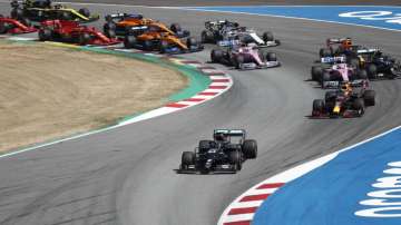 Mercedes driver Lewis Hamilton of Britain leads the pack out of the 1st curve during the Formula One Grand Prix at the Barcelona Catalunya racetrack in Montmelo, Spain, Sunday, Aug. 16