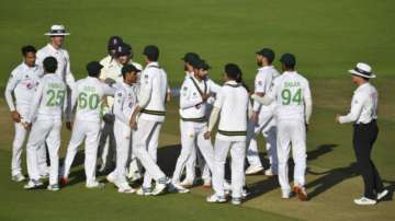 Players of both teams greet each other at the end of the fifth day of the second cricket Test match between England and Pakistan, at the Ageas Bowl in Southampton, England, Monday, Aug. 17