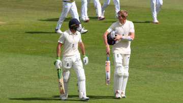 Jos Buttler and Zak Crawley of England walk off at lunch during Day Two of the 3rd #RaiseTheBat Test Match between England and Pakistan at the Ageas Bowl on August 22, 2020 in Southampton.