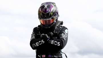 Mercedes driver Lewis Hamilton of Britain reacts after the qualifying session prior to the Formula One Grand Prix at the Spa-Francorchamps racetrack in Spa, Belgium Saturday, Aug. 29, 2020. Hamilton will start in pole position for race on Sunday.