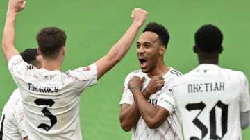 Arsenal's Pierre-Emerick Aubameyang, 2nd right, celebrates after scoring the opening goal during the English FA Community Shield soccer match between Arsenal and Liverpool at Wembley stadium in London, Saturday, Aug. 29