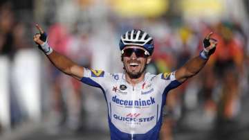 France's Julian Alaphilippe, celebrates as he crosses the finish line to win the second stage of the Tour de France cycling race over 186 kilometers (115,6 miles) with start and finish in Nice, southern France, Sunday, Aug. 30