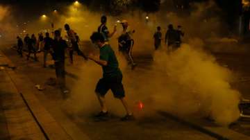 Fans clash with Paris riot police after PSG lose Champions League final