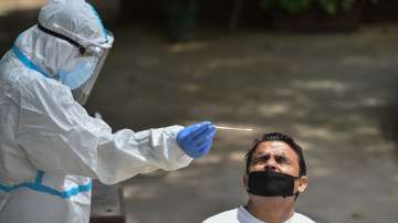 A health worker collects samples for COVID-19 rapid antigen testing, in New Delhi, Tuesday, Aug. 4, 