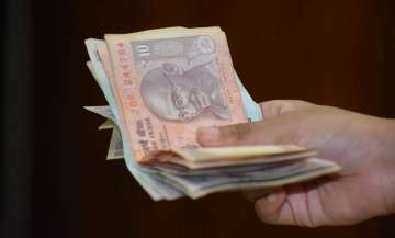 Rupee settles flat at 74.94 against USD after RBI keeps rates on hold